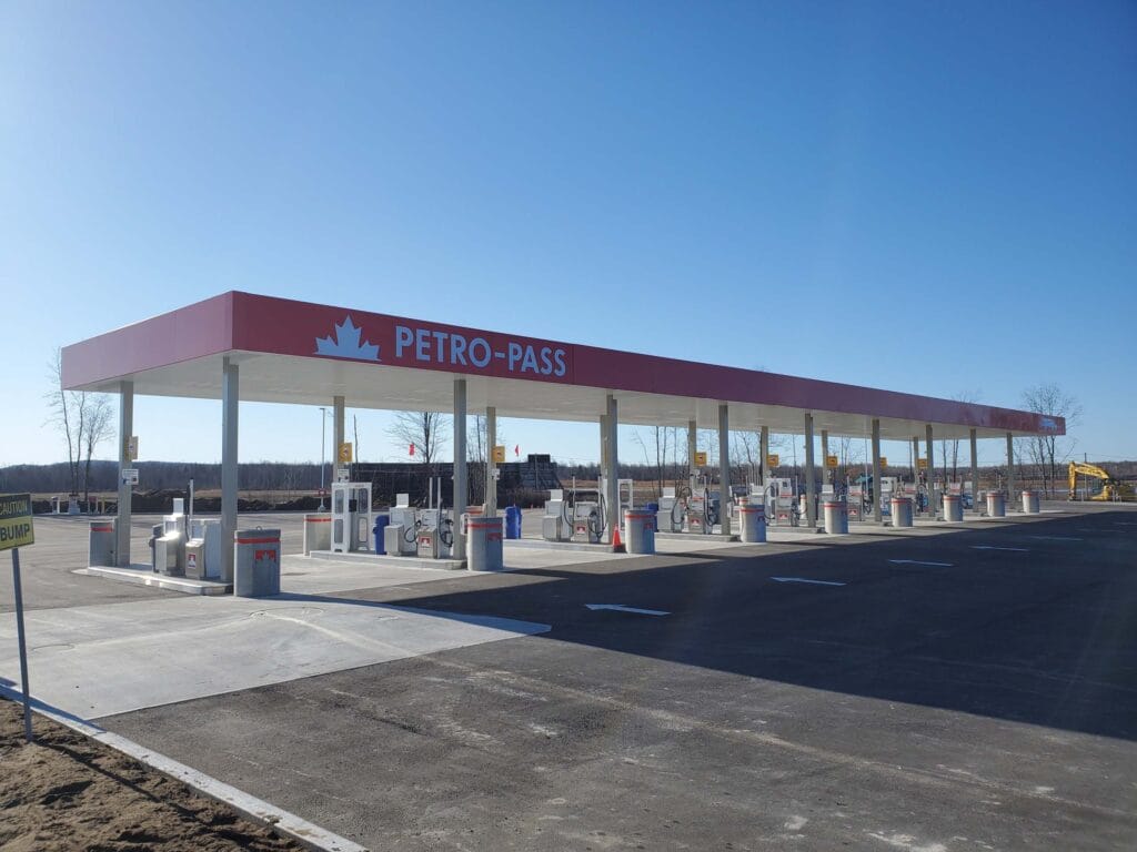 A large row of diesel pumps at a semi truck gas station