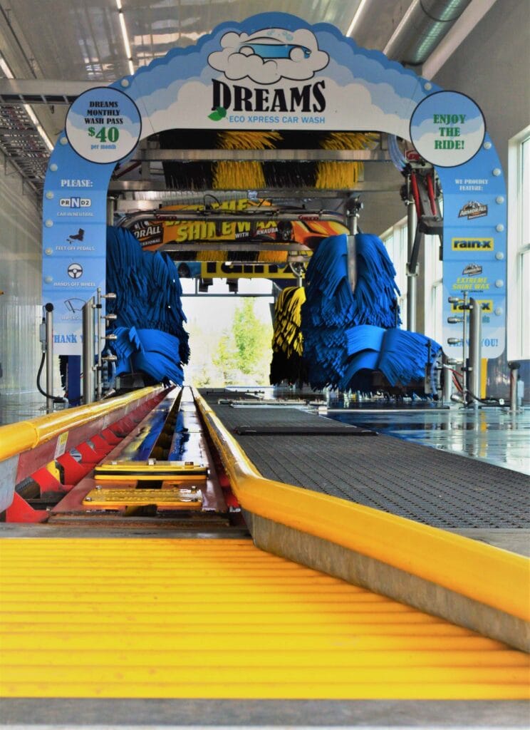 Inside the soft touch conveyor car wash looking from the ground